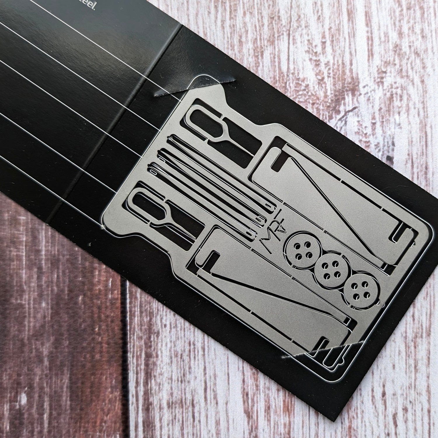 Survival kit cards close-up texture — 440C steel — Designed in Ukraine