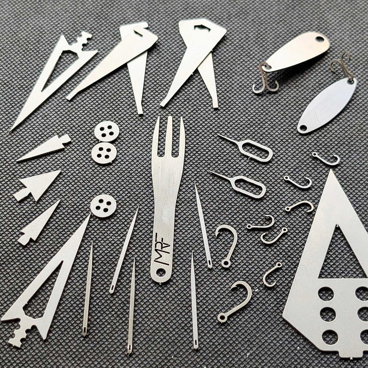 Survival kit Fisherman card detail showing hooks — Designed in Ukraine
