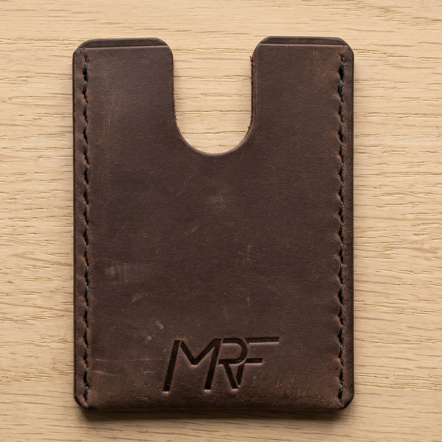 MRF leather sleeve protecting a titanium card multitool — Designed in Ukraine by MRF Tools