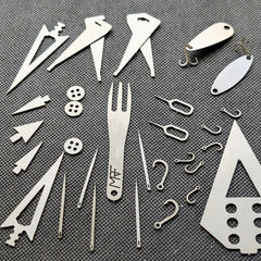 Survival kit Fisherman card detail showing hooks — Designed in Ukraine
