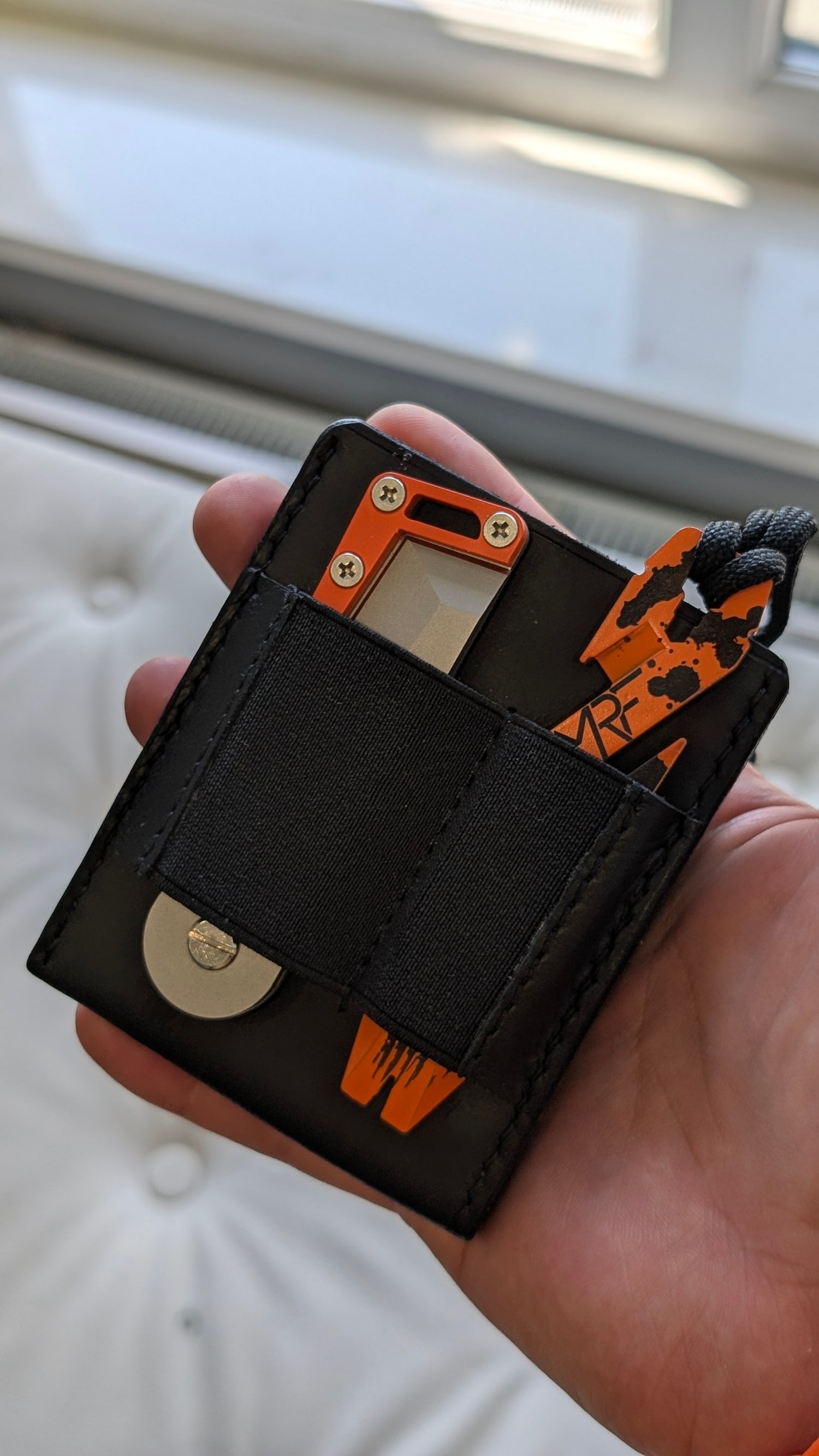 MRF Wallet angled lifestyle shot — handmade leather cardholder — Designed in Ukraine