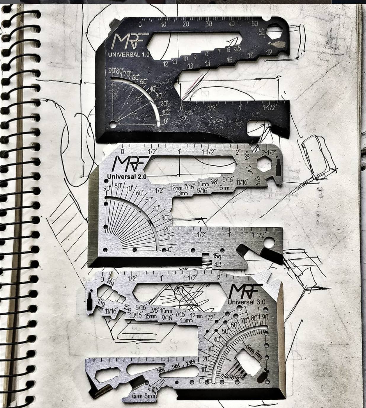 Universal 1.0, 2.0 and 3.0 laid on the sketchbook page they were drawn on