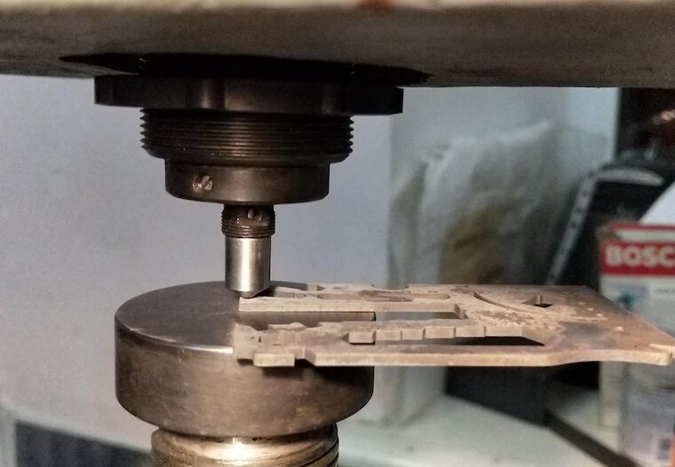 A card in the hardness tester before shipping