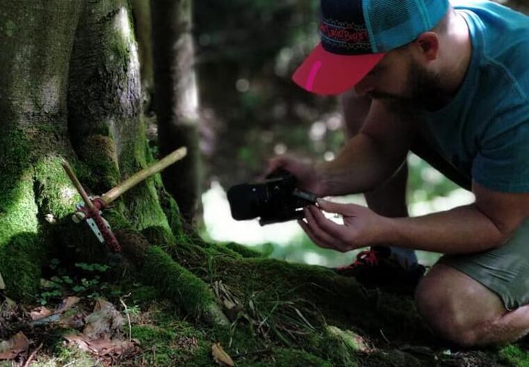 Victor filming a field test in the forest